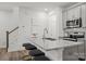 Kitchen with a large island, granite countertops, stainless steel appliances, and seating at 5025 Cherry Gum Ct # 47, Matthews, NC 28105