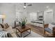 Open-concept living area flows into kitchen, featuring hardwood floors and neutral decor at 5025 Cherry Gum Ct # 47, Matthews, NC 28105