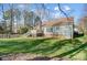 View of backyard featuring a deck, lawn, mature trees, and partial view of the home at 6038 Burnt Mill Run, Matthews, NC 28104