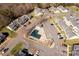 Aerial view of community pool, parking, and nearby homes in a residential neighborhood at 605 Gable Dr, Rock Hill, SC 29732