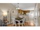 Cozy dining area with a wooden table, white chairs, and a view into the kitchen at 605 Gable Dr, Rock Hill, SC 29732