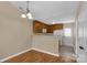 Eat-in kitchen features wood floors, neutral walls, wood cabinets, and white appliances at 605 Gable Dr, Rock Hill, SC 29732