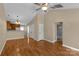An open floor plan living room features wood floors, neutral paint, and a ceiling fan at 605 Gable Dr, Rock Hill, SC 29732