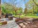 Large backyard with hot tub, seating, and playground at 6349 Lebanon Rd, Mint Hill, NC 28227