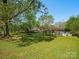 Large backyard with a gazebo, a trampoline, a hot tub and luscious green grass at 6349 Lebanon Rd, Mint Hill, NC 28227