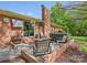 Backyard patio features a hot tub, fireplace, and ample seating at 6349 Lebanon Rd, Mint Hill, NC 28227
