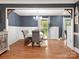 Elegant dining room with hardwood floors, wainscoting, stylish lighting, and a comfortable dining set at 6349 Lebanon Rd, Mint Hill, NC 28227