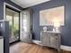 Stylish entryway featuring hardwood floors, gray walls, and elegant decor with a view of the porch at 6349 Lebanon Rd, Mint Hill, NC 28227