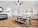 Spacious game room features a pool table, hardwood floors, and multiple seating areas at 6349 Lebanon Rd, Mint Hill, NC 28227