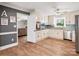 Bright kitchen featuring white cabinets, stainless steel appliances, and hardwood floors at 6349 Lebanon Rd, Mint Hill, NC 28227