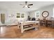 Entertaining living room features a pool table, seating, and wet bar with wood flooring at 6349 Lebanon Rd, Mint Hill, NC 28227