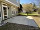 Exterior view features a backyard, a patio and green siding at 6827 Neuhoff Ln, Charlotte, NC 28269