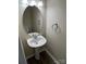 A half bathroom featuring a pedestal sink and modern fixtures at 6827 Neuhoff Ln, Charlotte, NC 28269