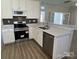 Close up of the kitchen with stainless steel appliances and a double sink at 6827 Neuhoff Ln, Charlotte, NC 28269