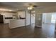 Open-concept living room and kitchen with hardwood floors and modern finishes at 6827 Neuhoff Ln, Charlotte, NC 28269