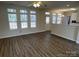 The bright living room features hardwood floors and large windows at 6827 Neuhoff Ln, Charlotte, NC 28269