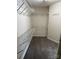 Walk-in closet featuring carpeted floors and multiple shelves and rods for ample storage at 6827 Neuhoff Ln, Charlotte, NC 28269