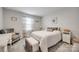Comfortable bedroom features neutral tones, a cushioned bench, and ample natural light at 715 Bonica Ct, Lancaster, SC 29720