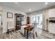 Cozy dining room featuring a wooden table with seating for four, a china cabinet, and sliding glass doors to a screened porch at 715 Bonica Ct, Lancaster, SC 29720