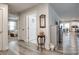 Hallway featuring wood floors, decorative accents, with views into other rooms of the home at 715 Bonica Ct, Lancaster, SC 29720