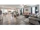 Open-concept living area with a view of the kitchen, comfortable seating, and hardwood floors at 715 Bonica Ct, Lancaster, SC 29720