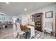 Inviting open floor plan with a dining area seamlessly connecting to the living room, showcasing modern decor and natural light at 715 Bonica Ct, Lancaster, SC 29720