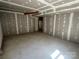 Unfinished basement with concrete flooring and drywall walls with an opening leading to another room at 7939 Holly Hill Rd, Charlotte, NC 28227