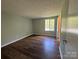 Bedroom featuring hardwood floors and natural light at 7939 Holly Hill Rd, Charlotte, NC 28227