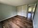 Inviting bedroom with hardwood floors and bi-fold closet doors at 7939 Holly Hill Rd, Charlotte, NC 28227