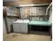 Basement laundry room with washer, dryer, and folding table at 7939 Holly Hill Rd, Charlotte, NC 28227