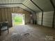 A spacious shed with a concrete foundation and a large double-door entrance for convenient access and versatile usage at 7939 Holly Hill Rd, Charlotte, NC 28227