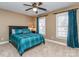 Bedroom with a large bed, two windows, and neutral walls at 8111 Sealey Ct, Charlotte, NC 28277