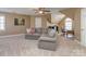 Cozy bonus room with comfortable sofa, a desk, and great natural light at 8111 Sealey Ct, Charlotte, NC 28277