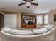 Comfortable bonus room featuring ample seating and a built-in entertainment center at 8111 Sealey Ct, Charlotte, NC 28277