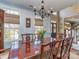 Dining room featuring a large wooden table and elegant chandelier at 8111 Sealey Ct, Charlotte, NC 28277