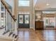 Inviting home foyer featuring hardwood floors and a staircase at 8111 Sealey Ct, Charlotte, NC 28277