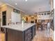 Stylish kitchen island with a granite countertop and a built-in wine rack at 8111 Sealey Ct, Charlotte, NC 28277