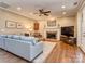 Inviting living room with hardwood floors, fireplace, and access to an outdoor deck at 8111 Sealey Ct, Charlotte, NC 28277