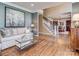 Spacious living room boasts beautiful hardwood floors and comfortable seating at 8111 Sealey Ct, Charlotte, NC 28277