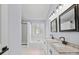 Bathroom with double vanity, granite countertops, tile floors, and a glass shower at 8733 Canter Post Dr, Charlotte, NC 28216