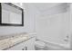 Bathroom with granite countertop vanity and shower over tub with white surround at 8733 Canter Post Dr, Charlotte, NC 28216
