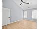 Spacious bedroom with ceiling fan, wood floors, and natural light from dual windows at 8733 Canter Post Dr, Charlotte, NC 28216