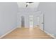 Spacious bedroom with ceiling fan, wood floors, and multiple closets at 8733 Canter Post Dr, Charlotte, NC 28216