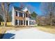 Traditional two-story home featuring brick and vinyl siding, black shutters, and a concrete driveway at 8733 Canter Post Dr, Charlotte, NC 28216