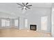 Open-concept living space with fireplace, vaulted ceilings, hardwood floors, and lots of natural light at 8733 Canter Post Dr, Charlotte, NC 28216
