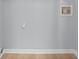Empty room with light gray walls and light wood flooring at 8733 Canter Post Dr, Charlotte, NC 28216