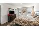 Bedroom featuring a decorative rug, floral-patterned bed set, large dresser and sunlit windows at 9740 Wardley Dr, Charlotte, NC 28215