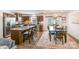 Charming kitchen flows to the dining area with chandelier and access to the outdoors at 9740 Wardley Dr, Charlotte, NC 28215