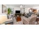 Spacious living room featuring hardwood floors, neutral paint, and a ceiling fan at 9740 Wardley Dr, Charlotte, NC 28215