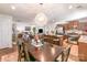 Open-concept living and kitchen area with modern chandelier over dining table at 9740 Wardley Dr, Charlotte, NC 28215